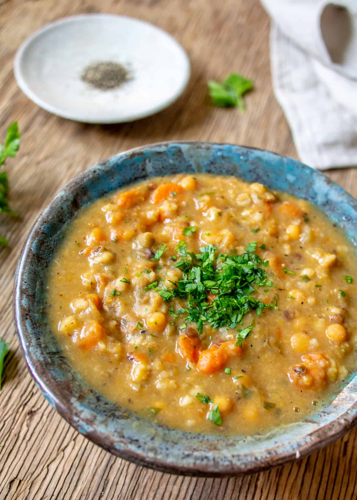 Side Shot of Vegetarian Bean Soup in Blue Bowl