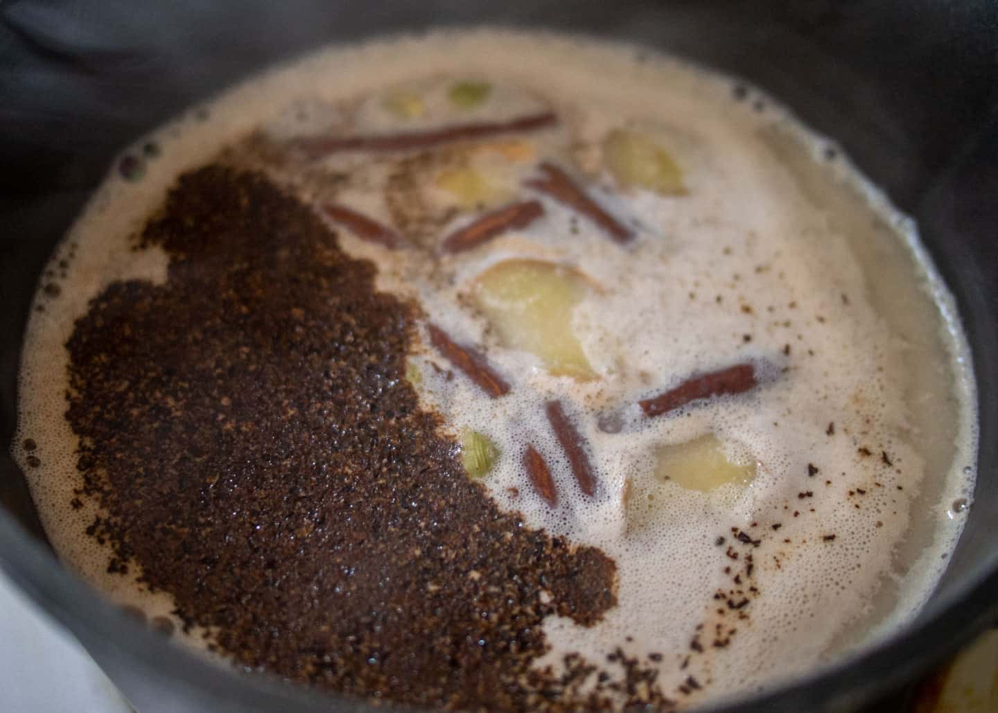 Tea and spices in warmed milk