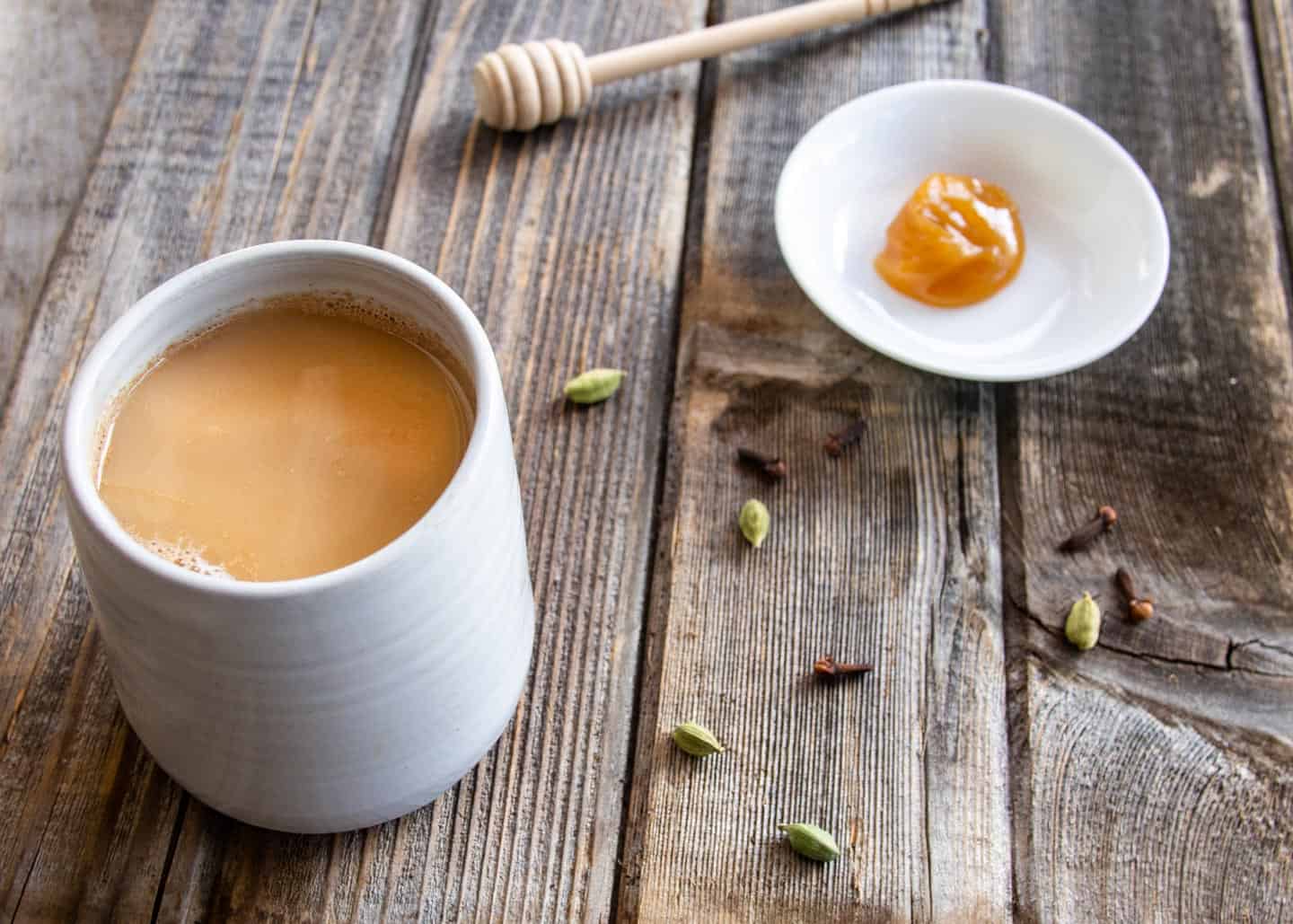 Indian spiced tea on wooden board