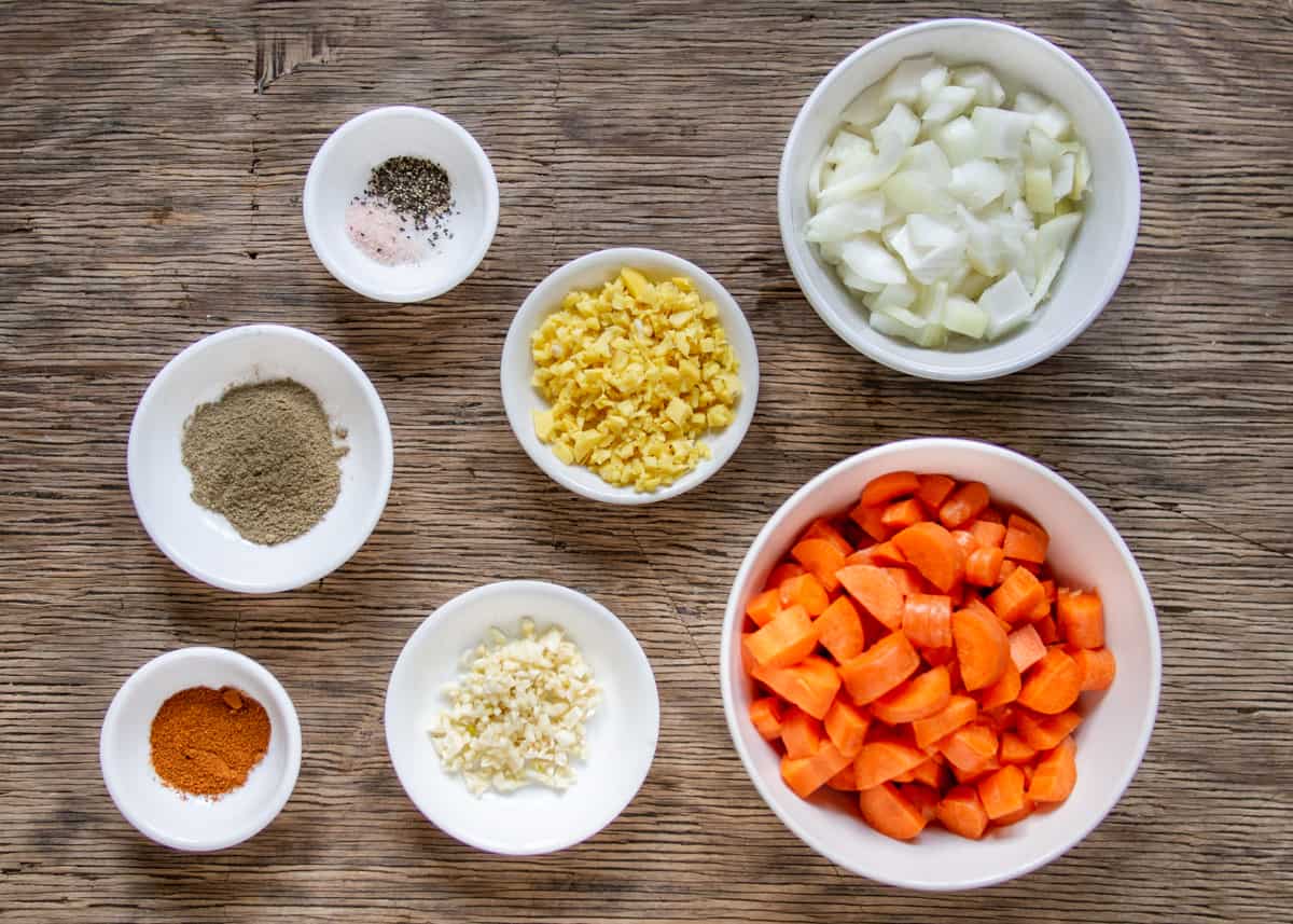 Ingredients for french lentil stew: ginger, garlic, onion, coriander, cayenne, carrots 