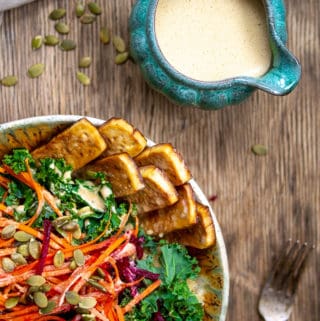 Kale Salad Bowl with Creamy Dressing in Blue Bowl