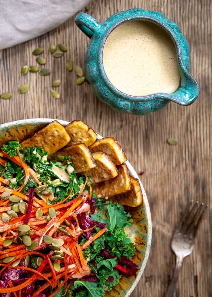 Kale Salad Bowl with Creamy Dressing in Blue Bowl