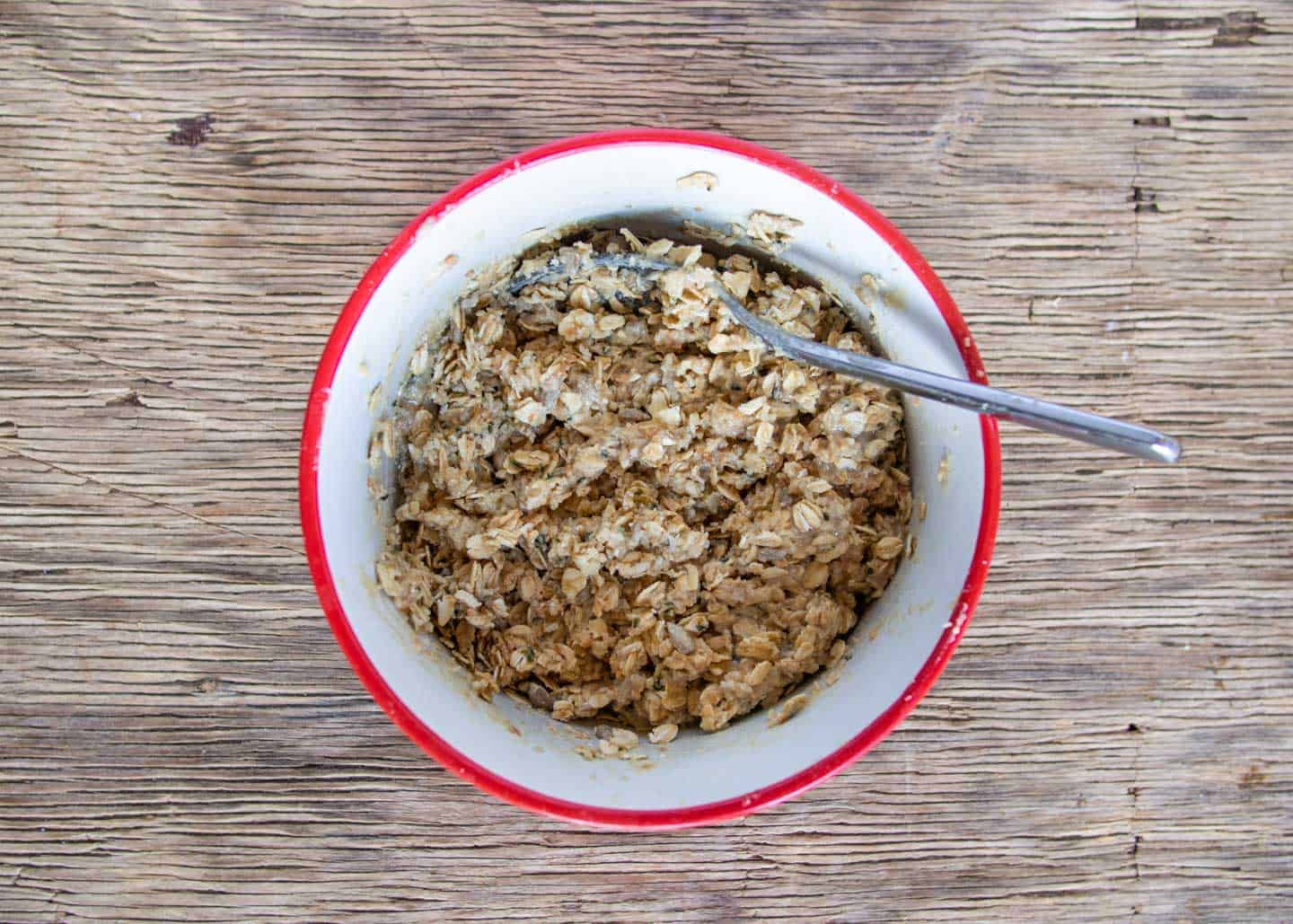 Ingredients for no-bake energy balls mixed in a bowl