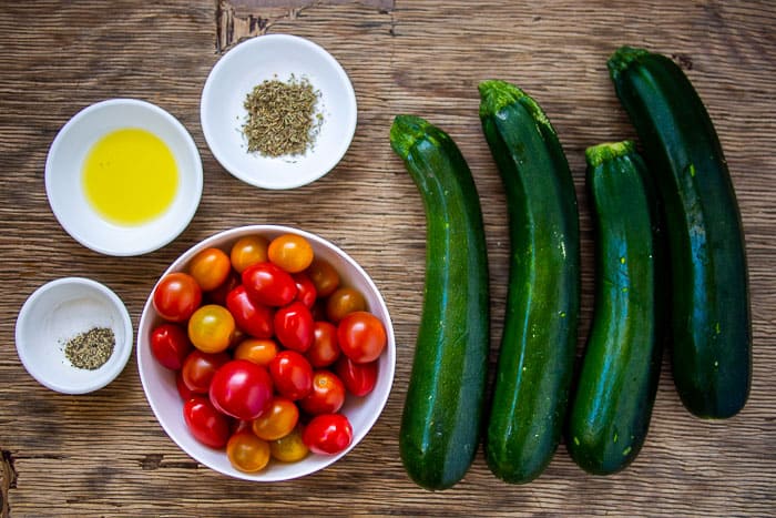 Zucchini Tomato Olive Oil and Thyme Ingredients in White Bowls