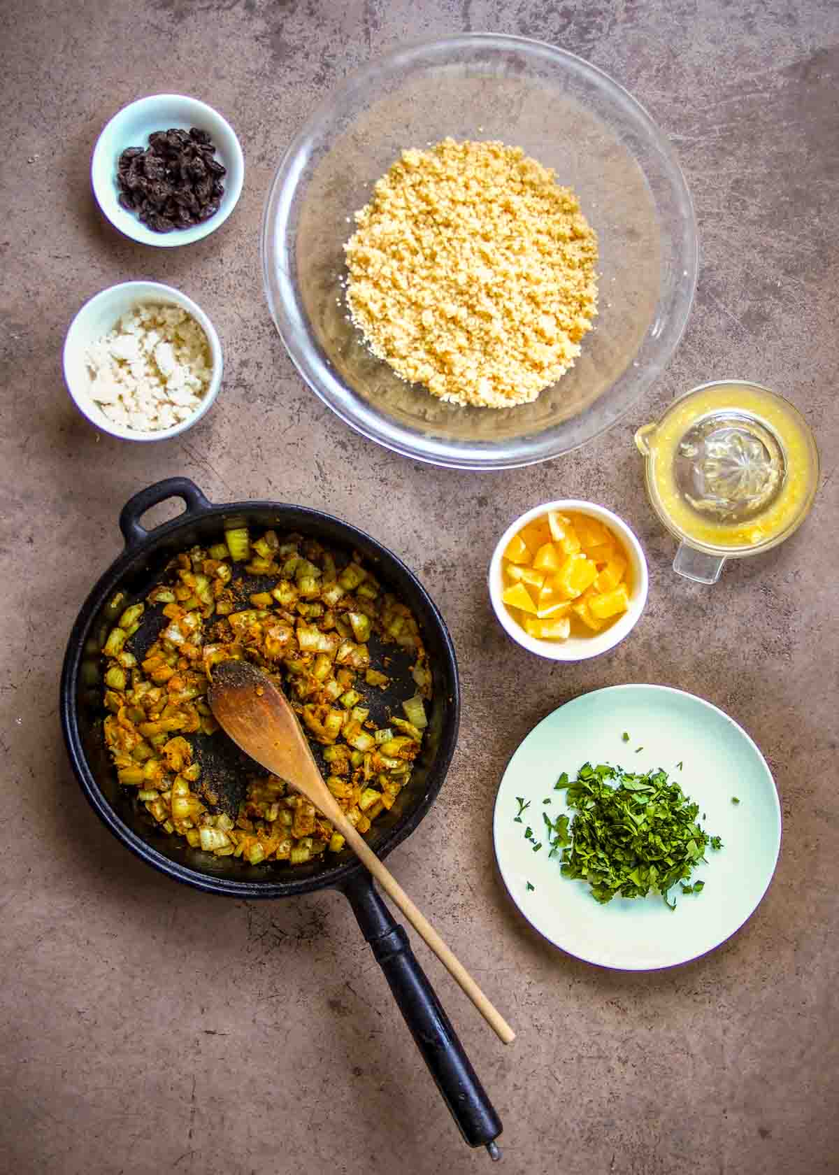 Ingredients for Moroccan couscous salad fried in frying pan before being added to couscous