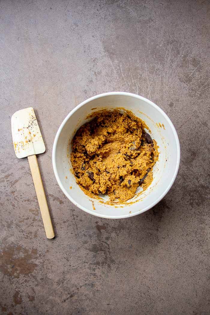 Batter for Soft Pumpkin Cookies in White Bowl with Spatula