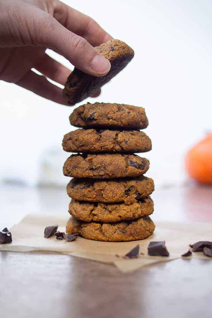 Stacked Pumpkin Spiced Cookies with Hand Placing Cookie On Top