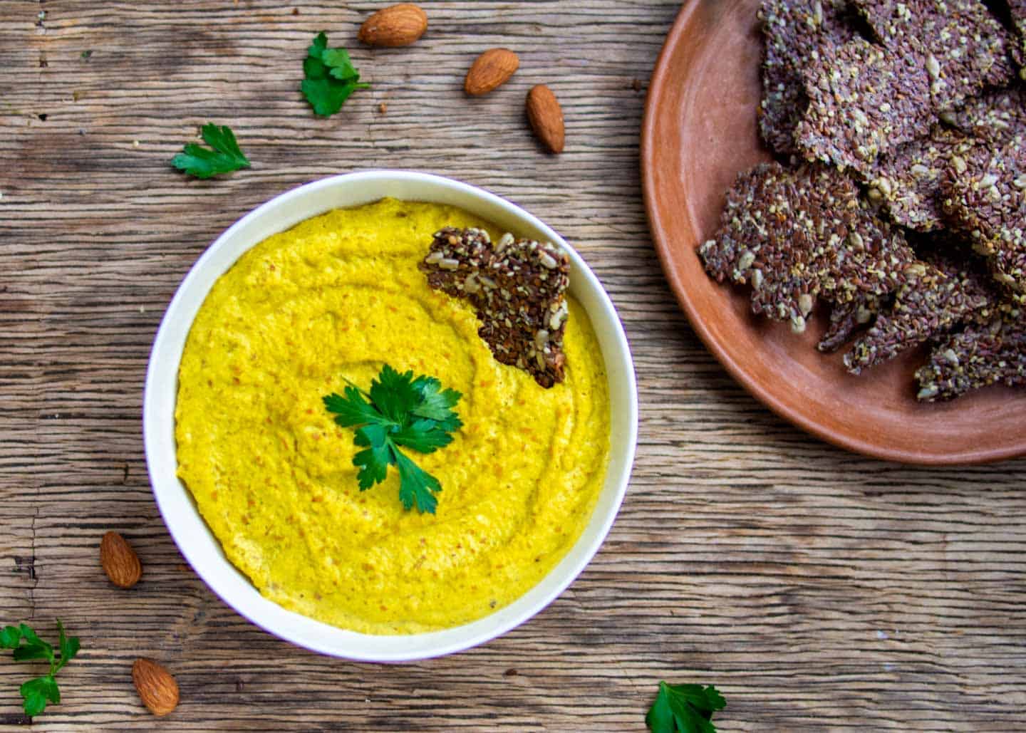 Raw almond dip in white bowl