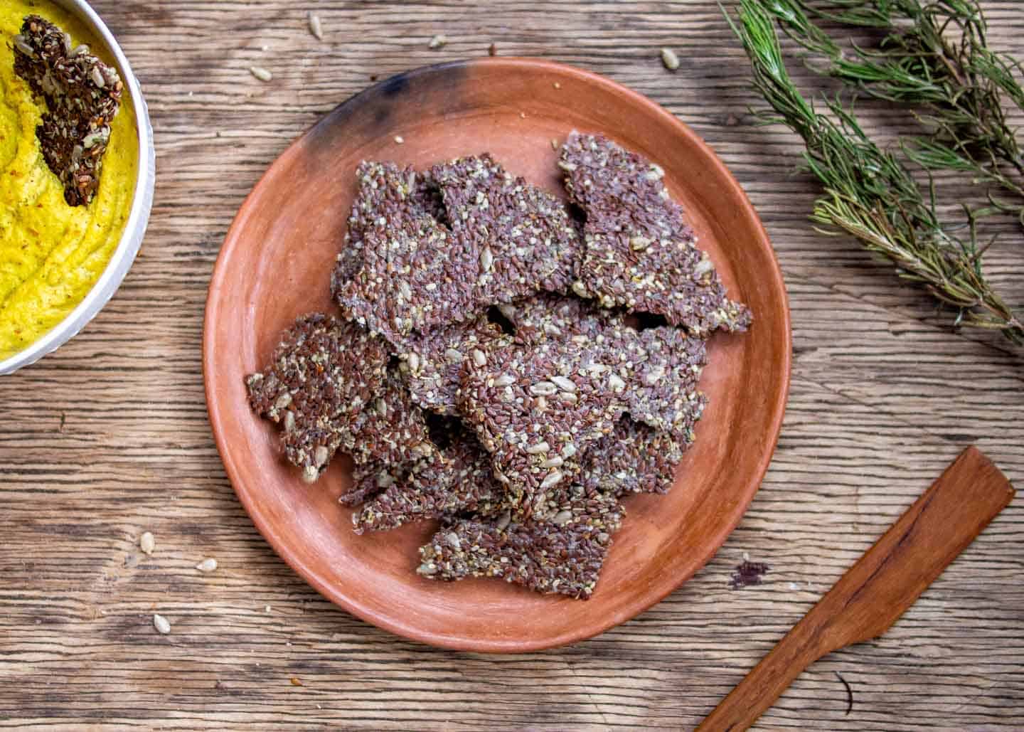 Flax Crackers on Clay Plate with Almond Dip On Side