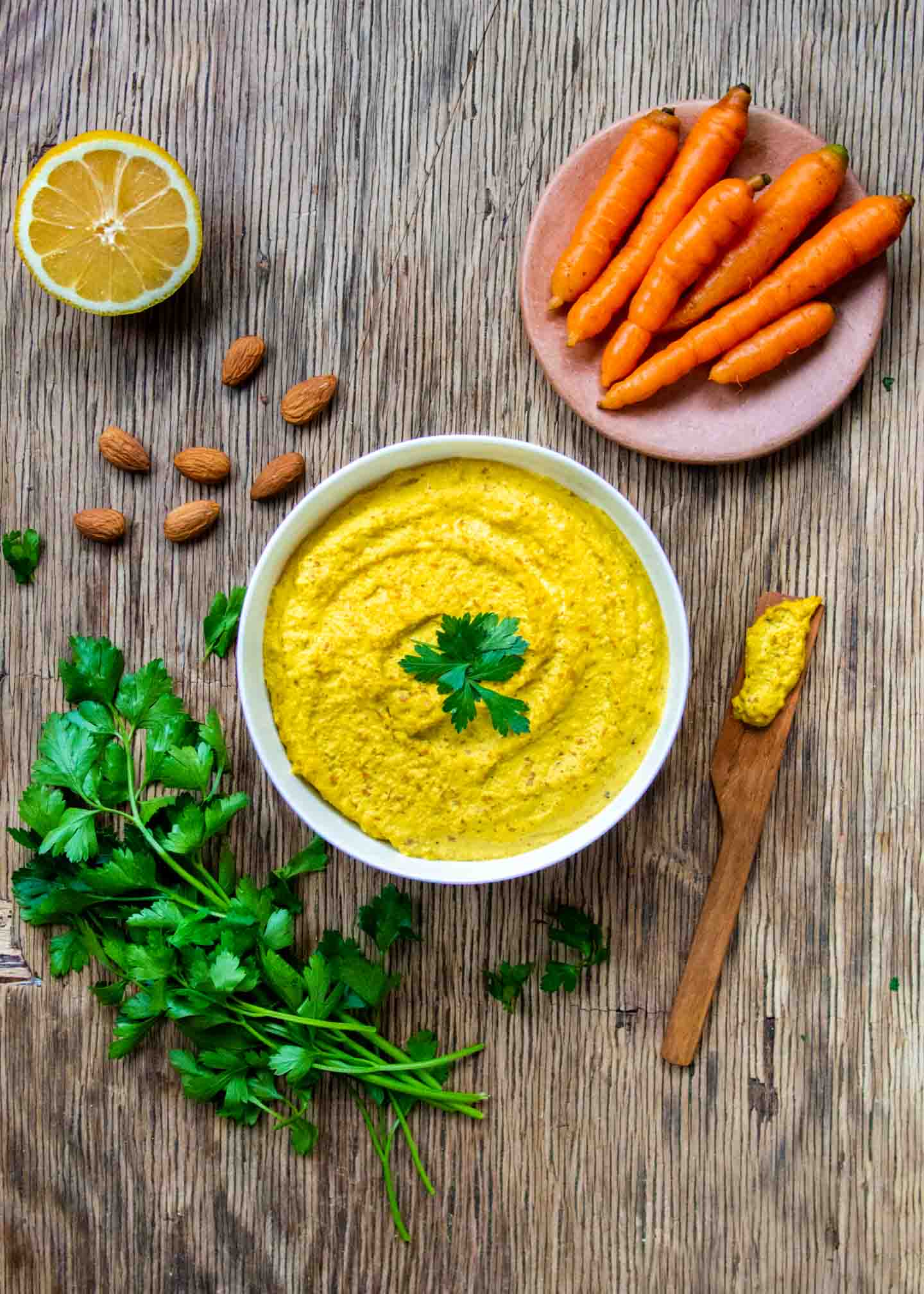 Raw Almond Dip in White Bowl with Carrots and Almonds On Side