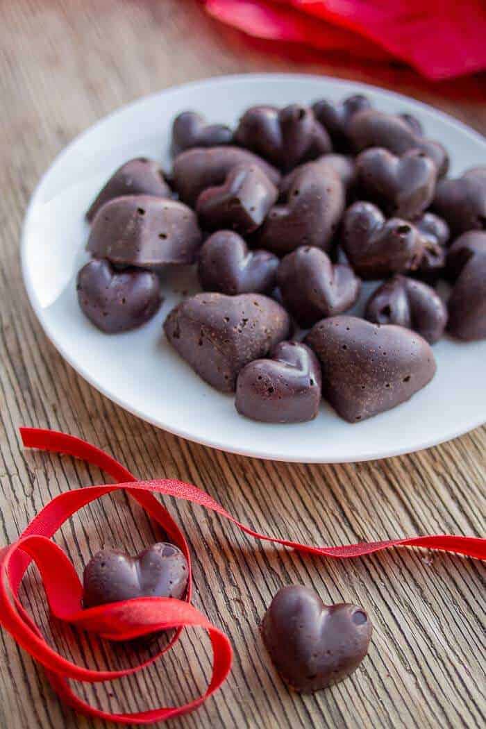 Raw Chocolate on a White Plate with Red Ribbon