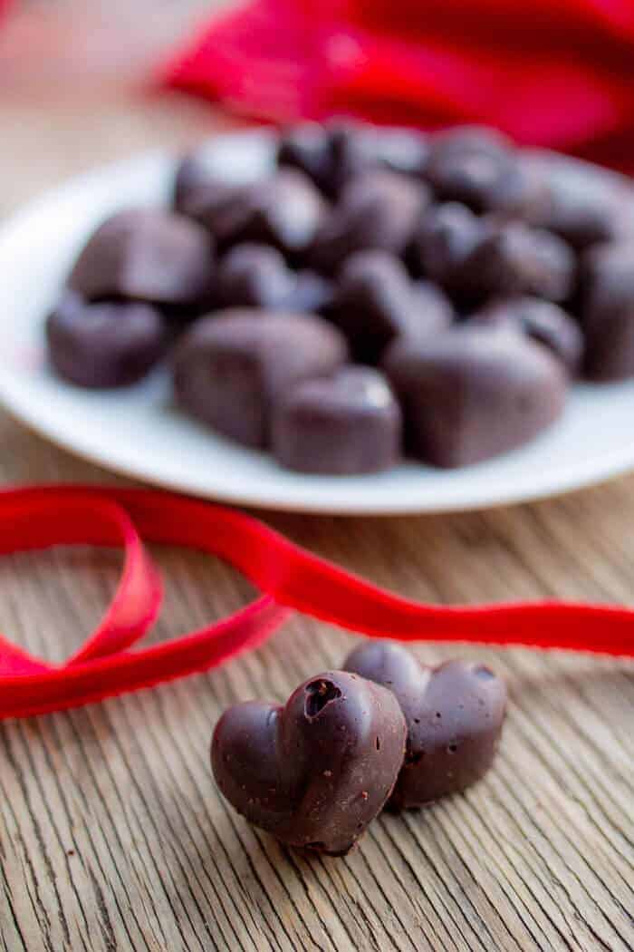 Heart Raw Chocolate On White Plate with Red Ribbon