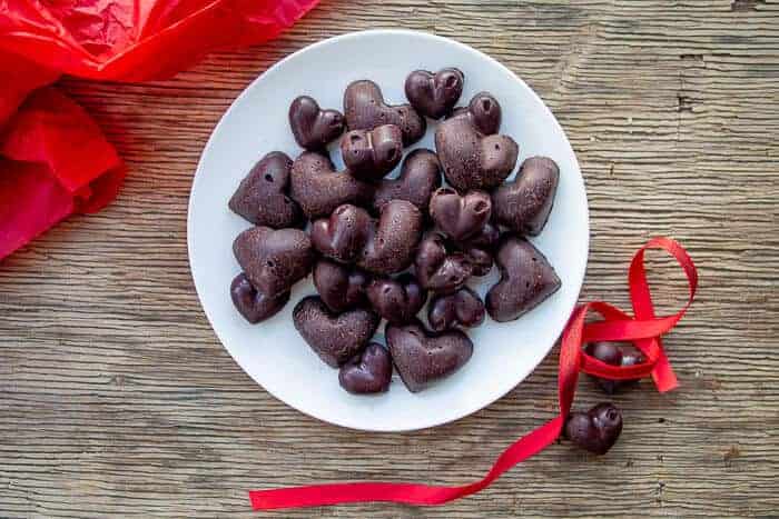 Heart Raw Chocolate on White Plate and Wooden Board