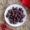 Raw Chocolate Hearts on White Plate on Wooden Background