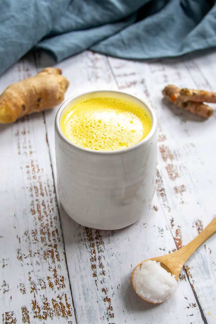 Turmeric Latte Recipe with Spoon of Coconut Oil