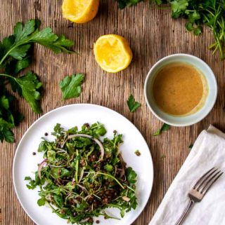 Lentil Salad on White Plate with Squeezed Lemons