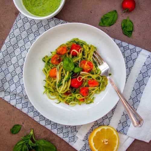 Vegan Zucchini Noodles with Pesto on White Plate