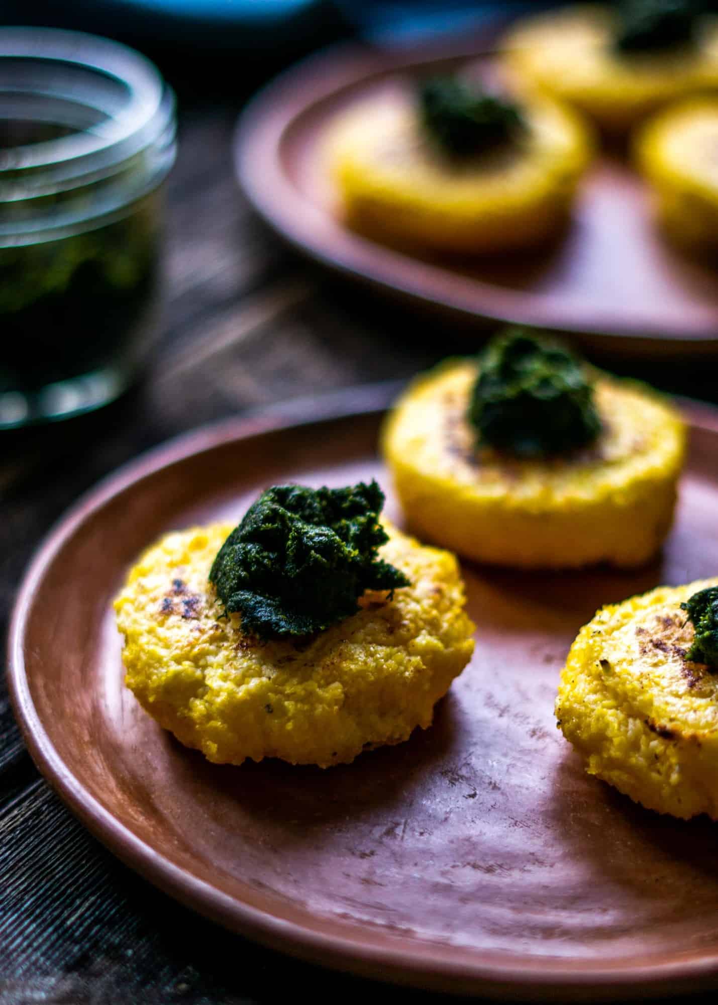 Corn patties topped with pesto