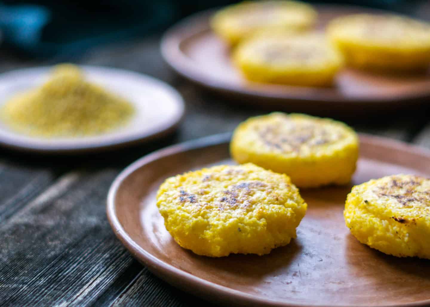 Corn patties on clay plates