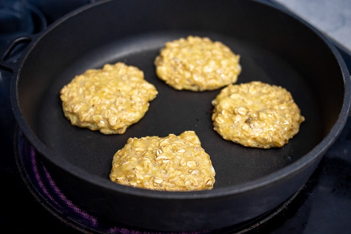 3 Ingredient Banana Oat Pancakes In Frying Pan