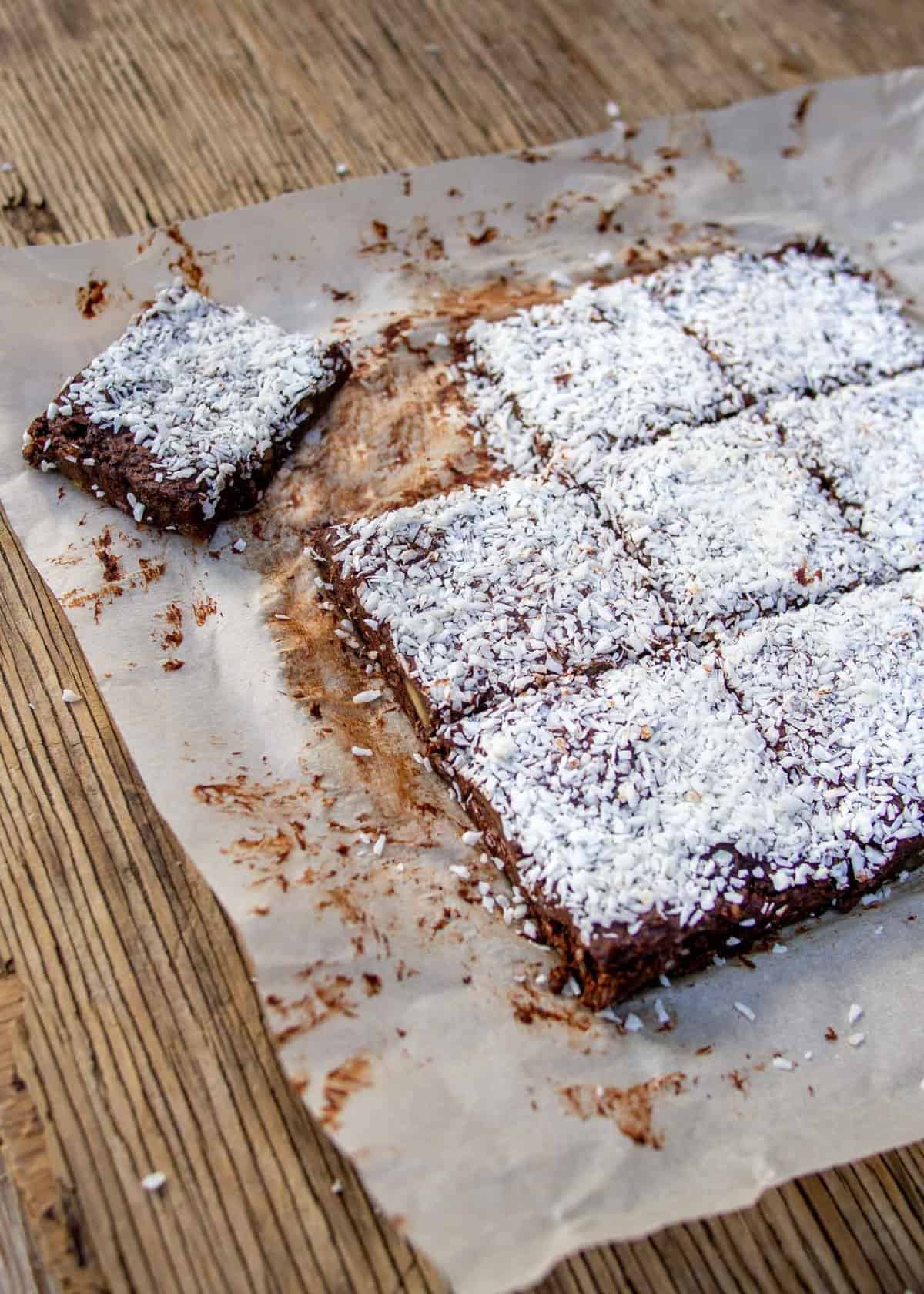 Raw Date Bars Cut Into Squares On Baking Paper