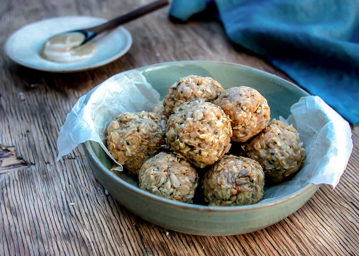 Close up of Tahini energy balls in blue bowl