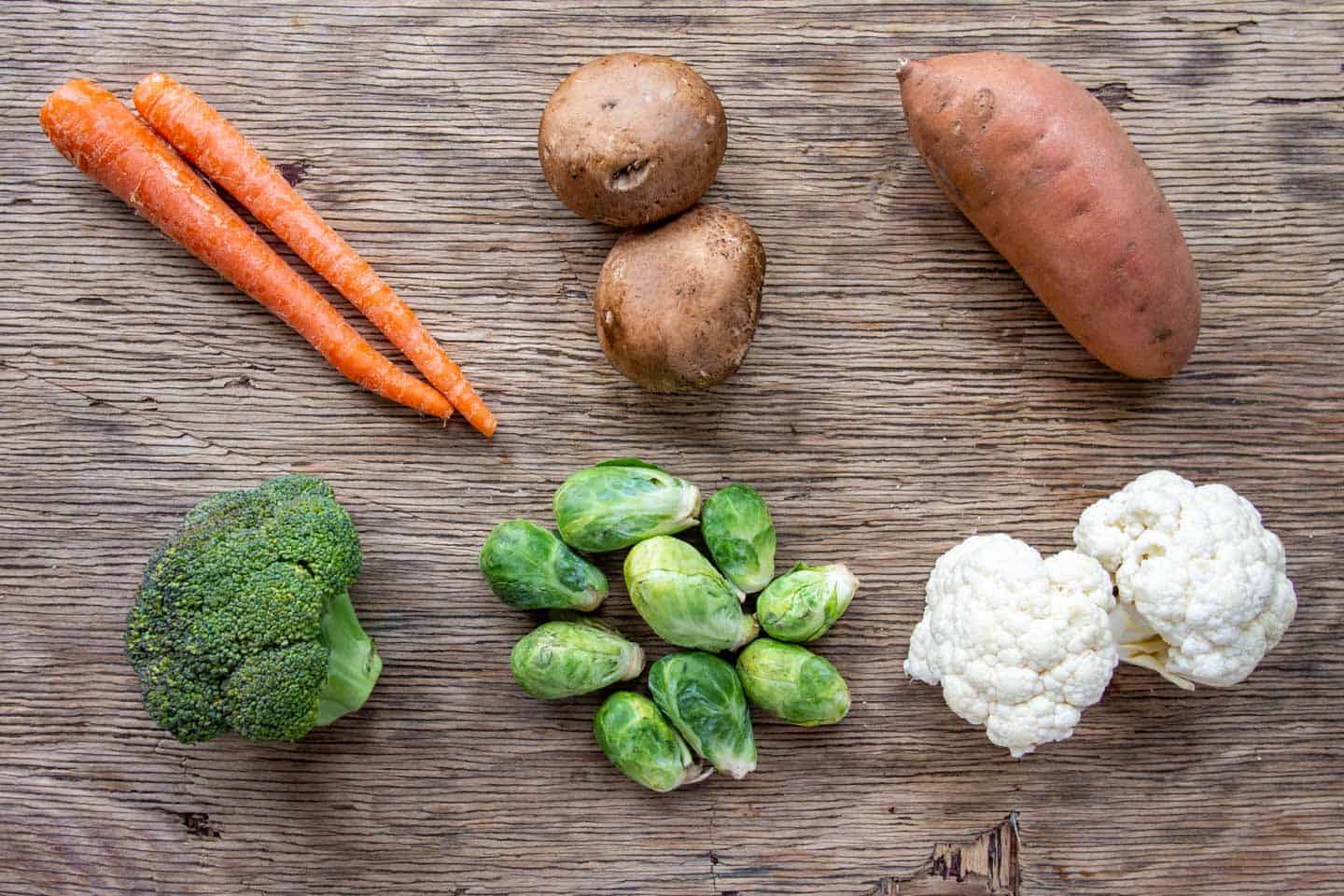 vegetables for roasting on wooden board