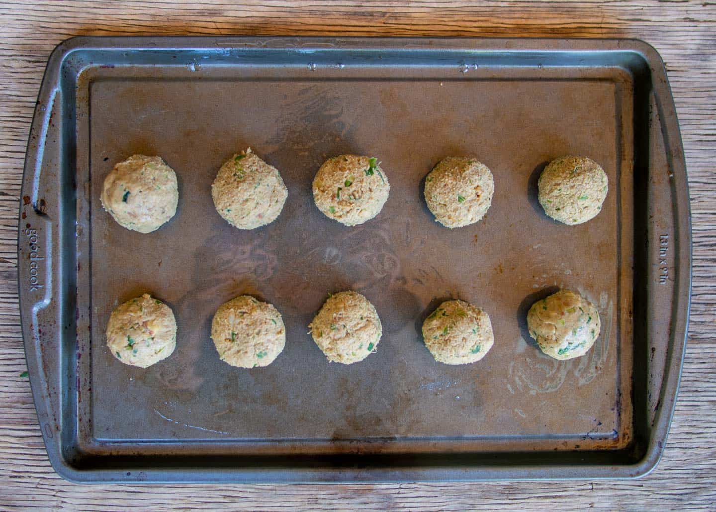 10 tempeh meatballs on a baking tray