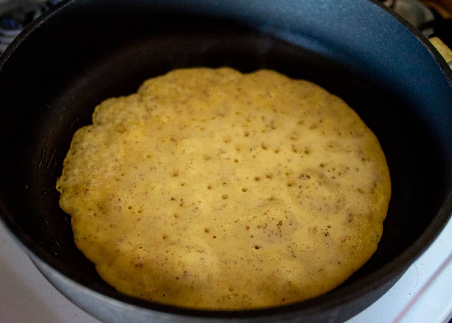 Chickpea flour batter in frying pan